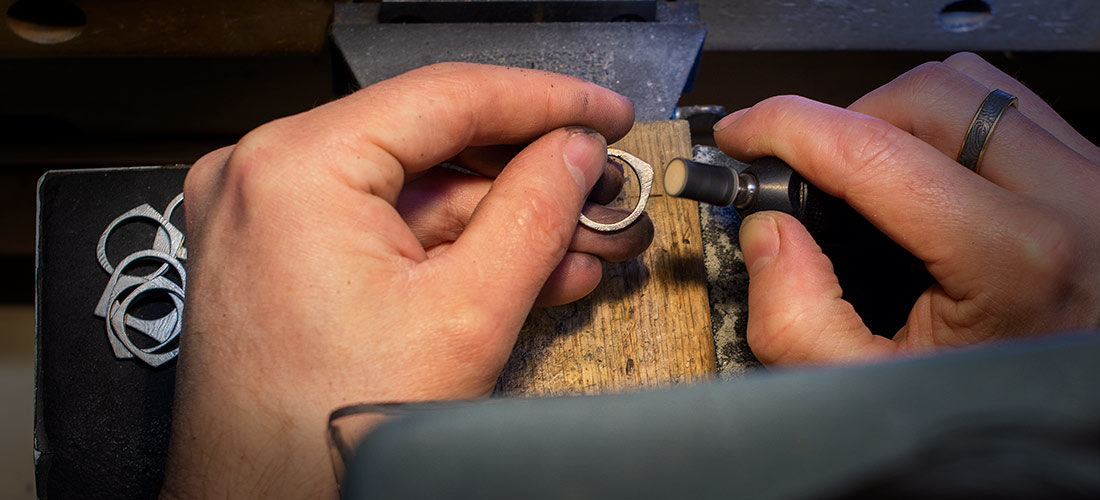 Chris Ploof working on a ring at the bench